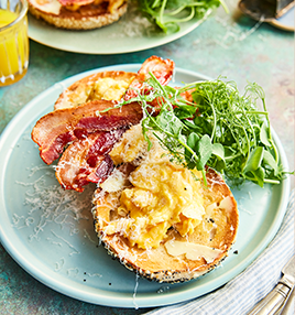 Parmesan scrambled eggs with bacon on bagels