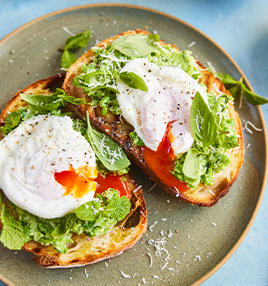 Poached eggs with herby smashed peas on toast